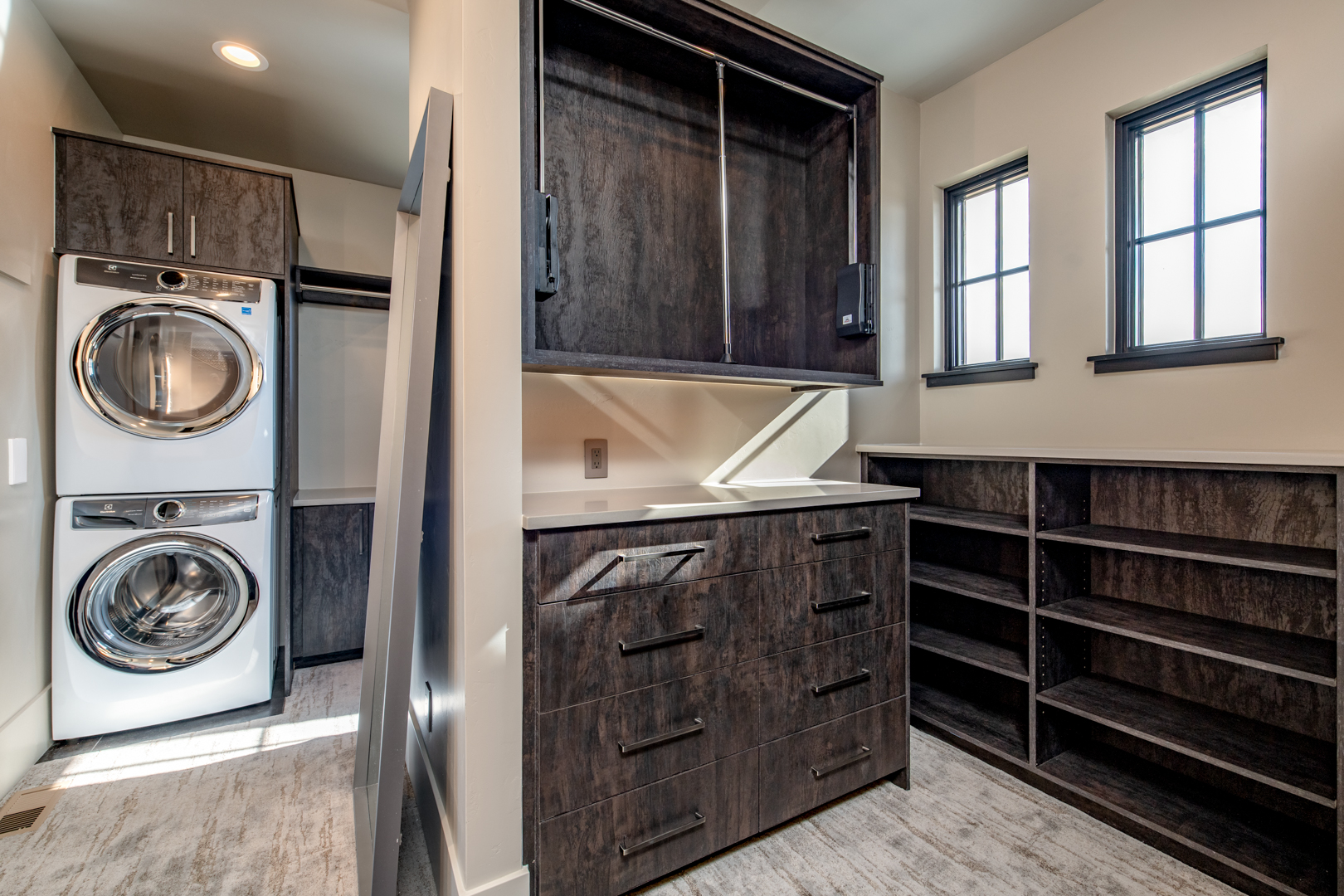 custom closet design with washer and dryer